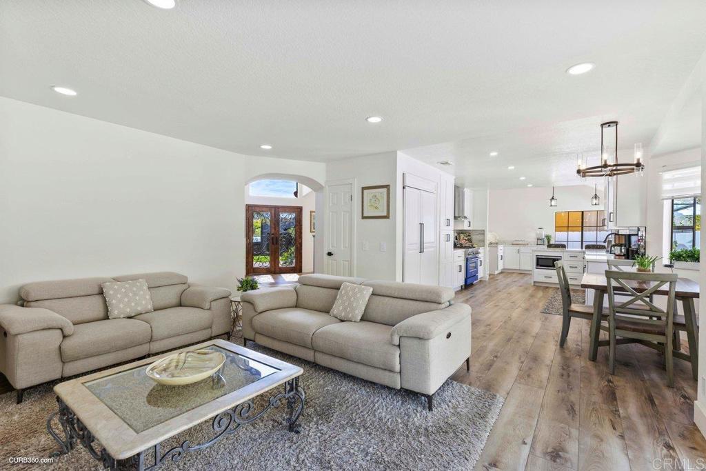 1618 Buttercup Road Encinitas, CA 92024 - Photo 17 of 33 a living room with furniture and wooden floor