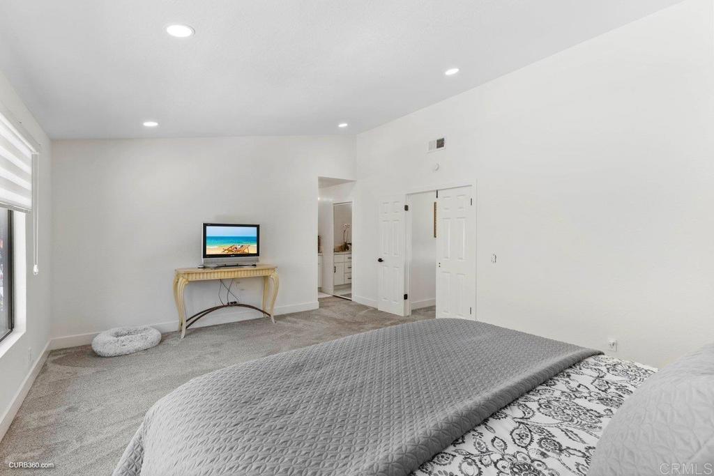 1618 Buttercup Road Encinitas, CA 92024 - Photo 22 of 33 a bedroom with a bed and a tv
