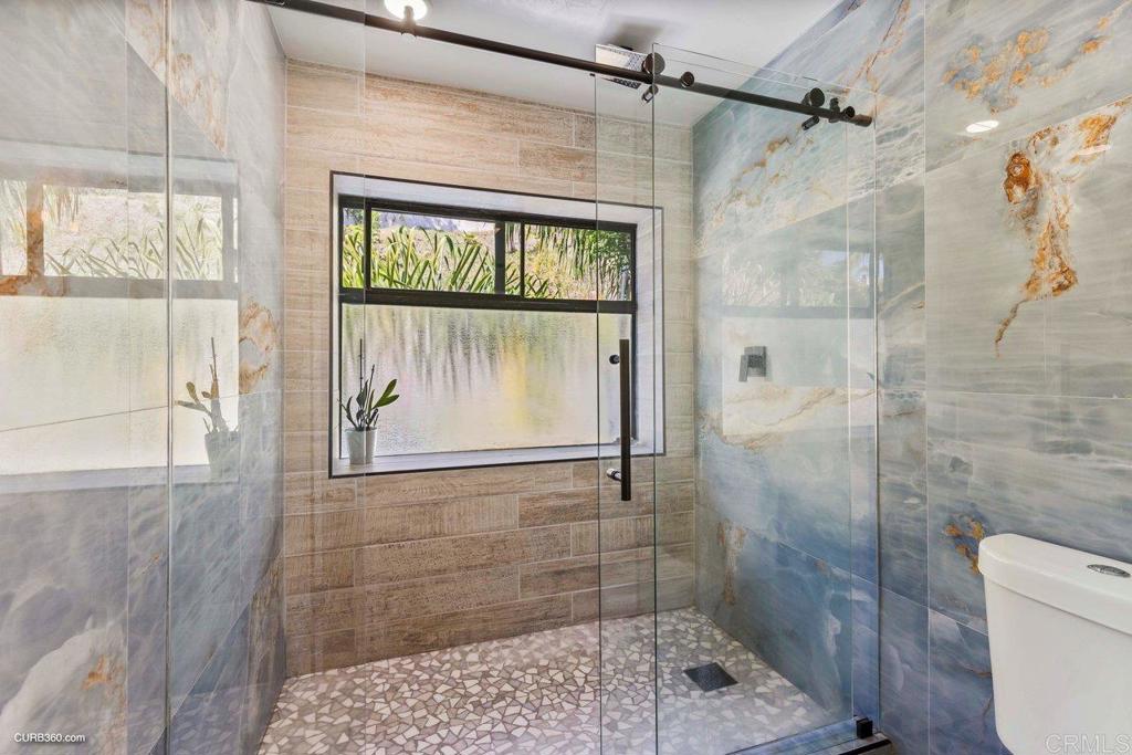 1618 Buttercup Road Encinitas, CA 92024 - Photo 24 of 33 a bathroom with a shower
