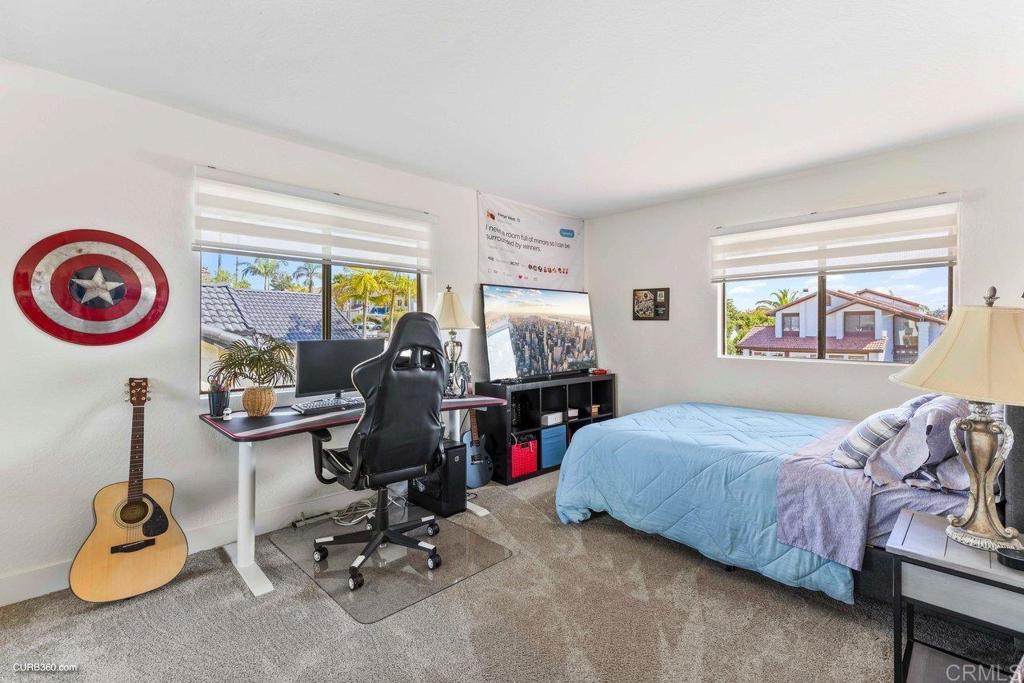 1618 Buttercup Road Encinitas, CA 92024 - Photo 26 of 33 a bedroom with bed and a large window