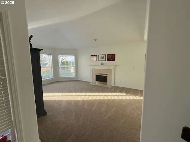 a view of livingroom with washer and dryer
