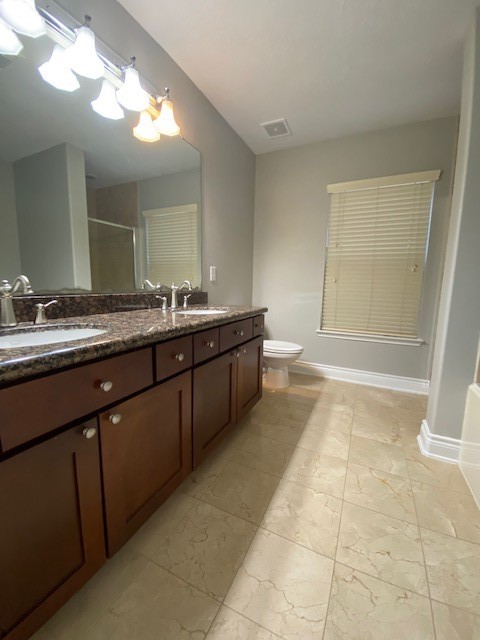 3415 Clearview Circle Houston, TX 77025 - Photo 12 of 16 a bathroom with a sink a large mirror and a bathtub