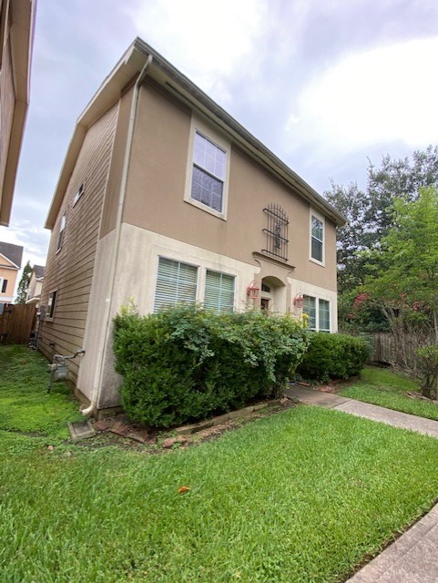 3415 Clearview Circle Houston, TX 77025 - Photo 2 of 16 a front view of a house with a yard
