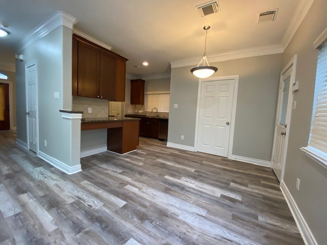 3415 Clearview Circle Houston, TX 77025 - Photo 7 of 16 a view of a kitchen with a sink cabinets and wooden floor