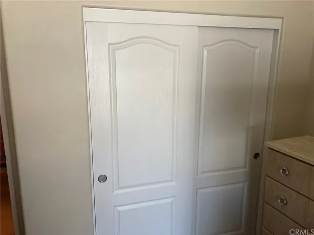 a sign broad in front of red brick house