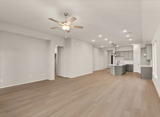 a view of a kitchen with a sink dishwasher and a refrigerator