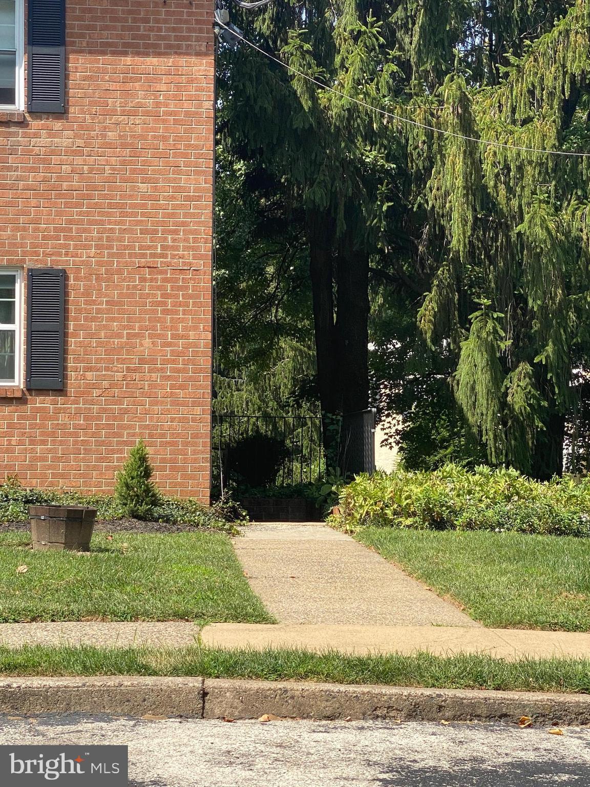 7302 Cresheim Road, Unit C4 Philadelphia, PA 19119 - Photo 27 of 29 basement entrance on the right side of the buildin
