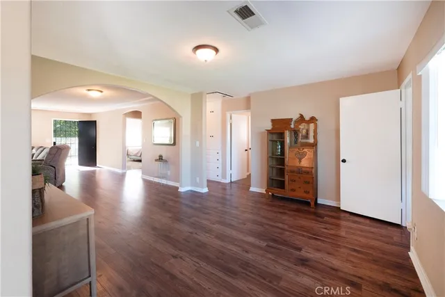 a view of a livingroom with wooden floor