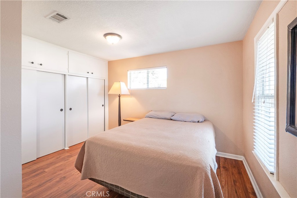 11665 Valverda Avenue Riverside, CA 92505 - Photo 20 of 53 a bedroom with a bed and a window