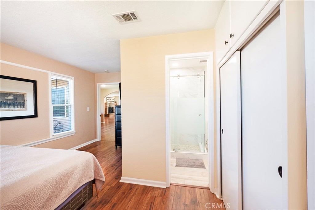 11665 Valverda Avenue Riverside, CA 92505 - Photo 23 of 53 a bedroom with a bed and a mirror