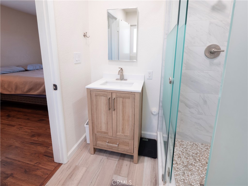 11665 Valverda Avenue Riverside, CA 92505 - Photo 24 of 53 a bathroom with a sink a toilet and shower