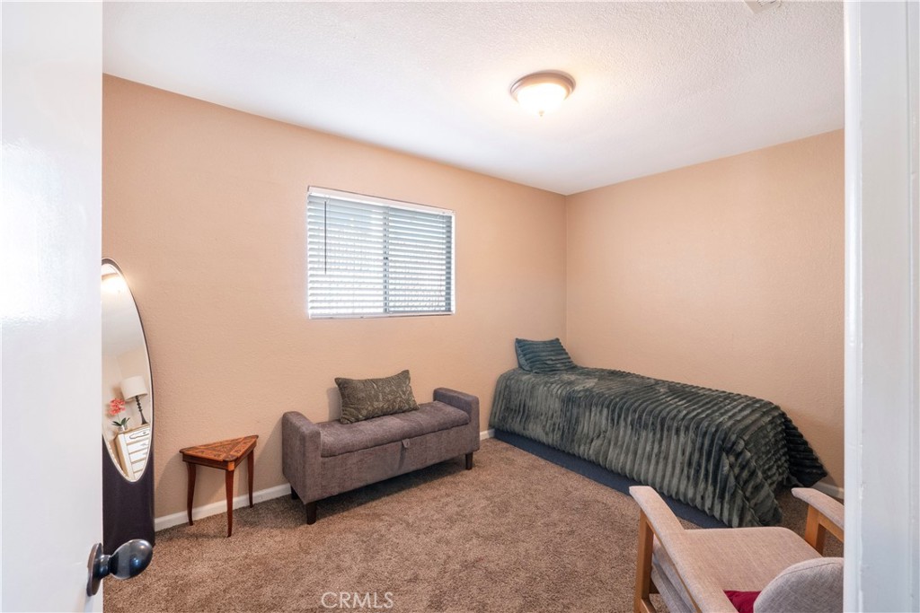 11665 Valverda Avenue Riverside, CA 92505 - Photo 26 of 53 a living room with furniture and a window