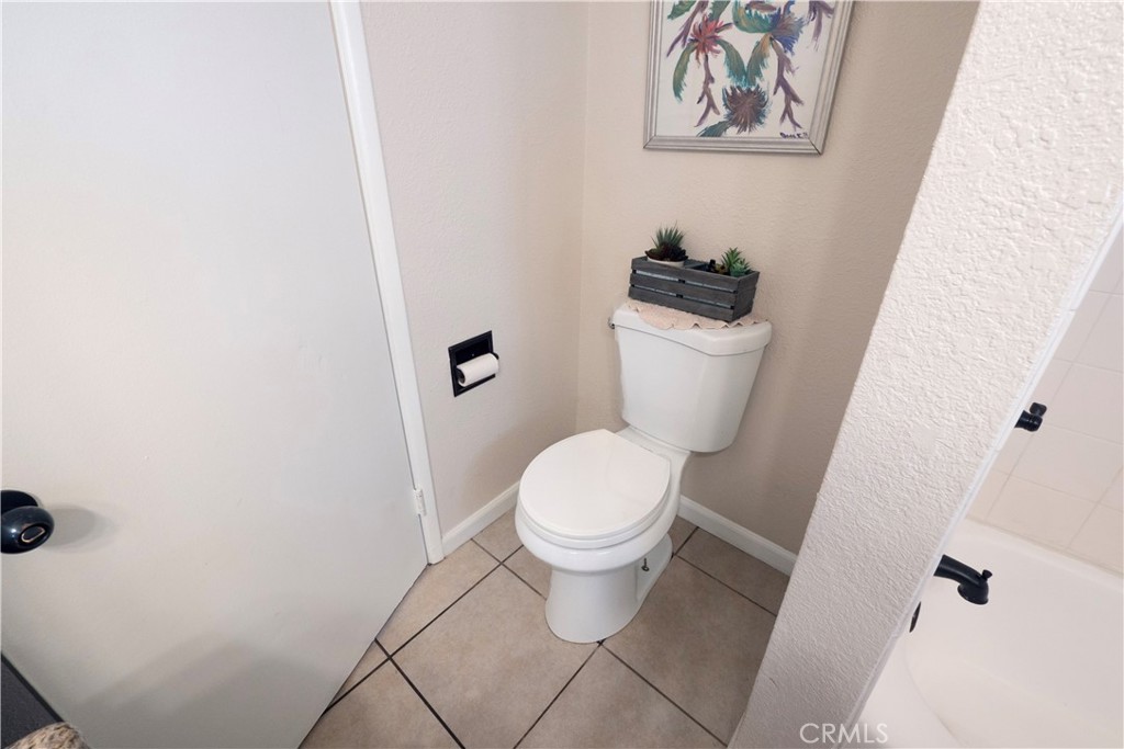 11665 Valverda Avenue Riverside, CA 92505 - Photo 30 of 53 a white toilet sitting next to a white wall