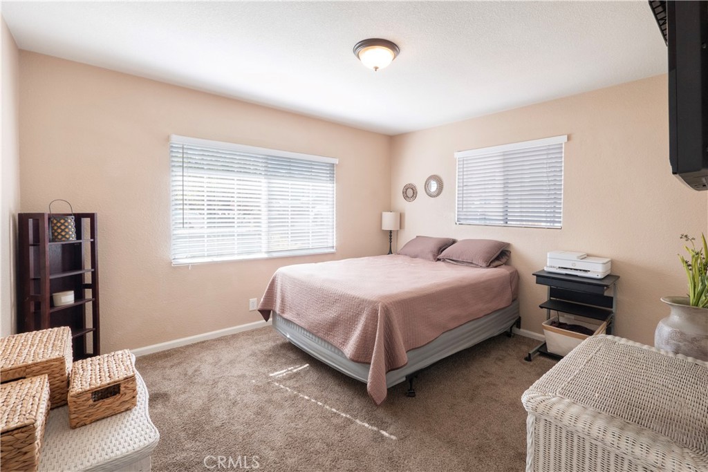 11665 Valverda Avenue Riverside, CA 92505 - Photo 32 of 53 a bedroom with a bed and a window