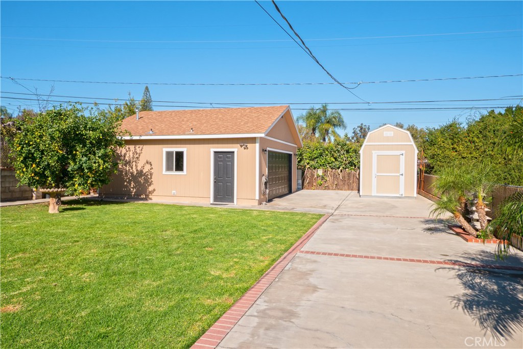 11665 Valverda Avenue Riverside, CA 92505 - Photo 33 of 52 a front view of a house with garden