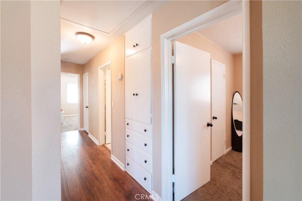 11665 Valverda Avenue Riverside, CA 92505 - Photo 34 of 53 a view of a hallway with wooden floor