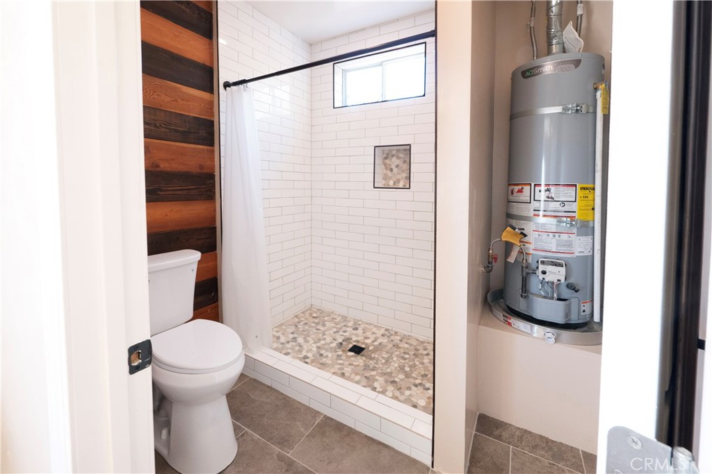 11665 Valverda Avenue Riverside, CA 92505 - Photo 37 of 52 a bathroom with a toilet and a shower