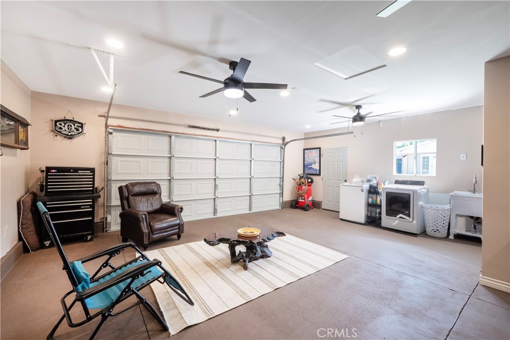 11665 Valverda Avenue Riverside, CA 92505 - Photo 40 of 53 a living room with furniture and a gym machine