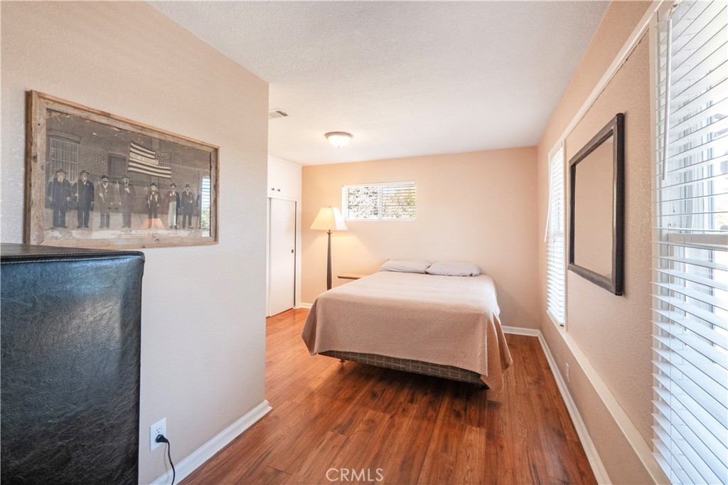 11665 Valverda Avenue Riverside, CA 92505 - Photo 6 of 53 a bedroom with a bed and a large window