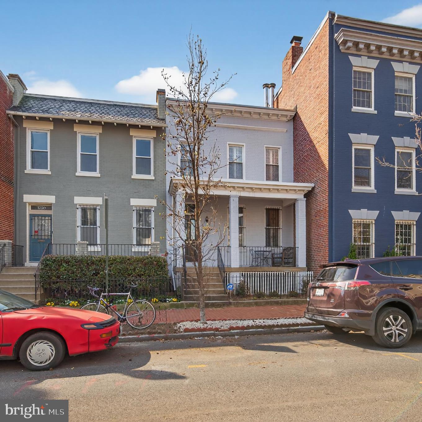 a front view of a house with parking space
