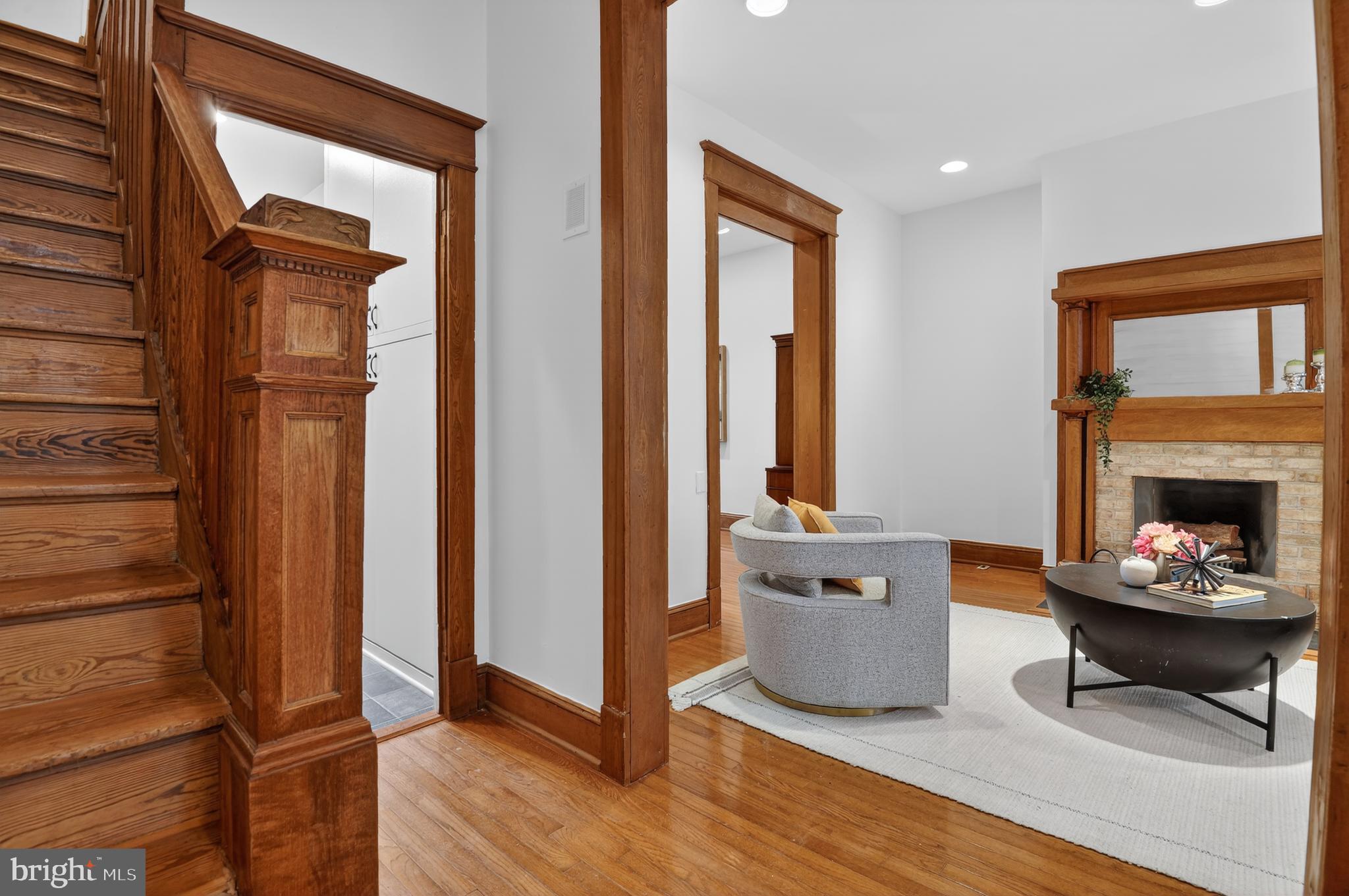 1752 Willard Street Northwest Washington, DC 20009 - Photo 4 of 26 a living room with furniture and a fireplace