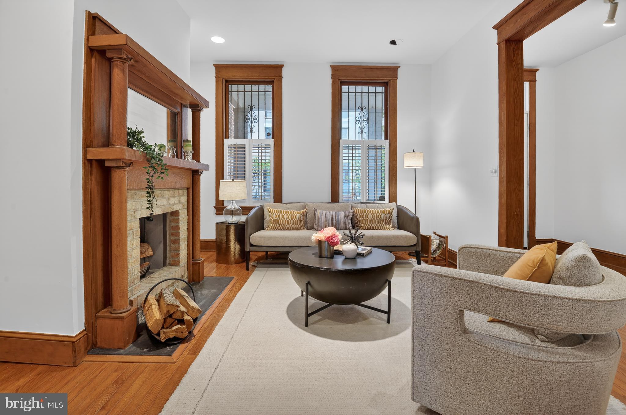 1752 Willard Street Northwest Washington, DC 20009 - Photo 5 of 26 a living room with furniture chess floor and a large window