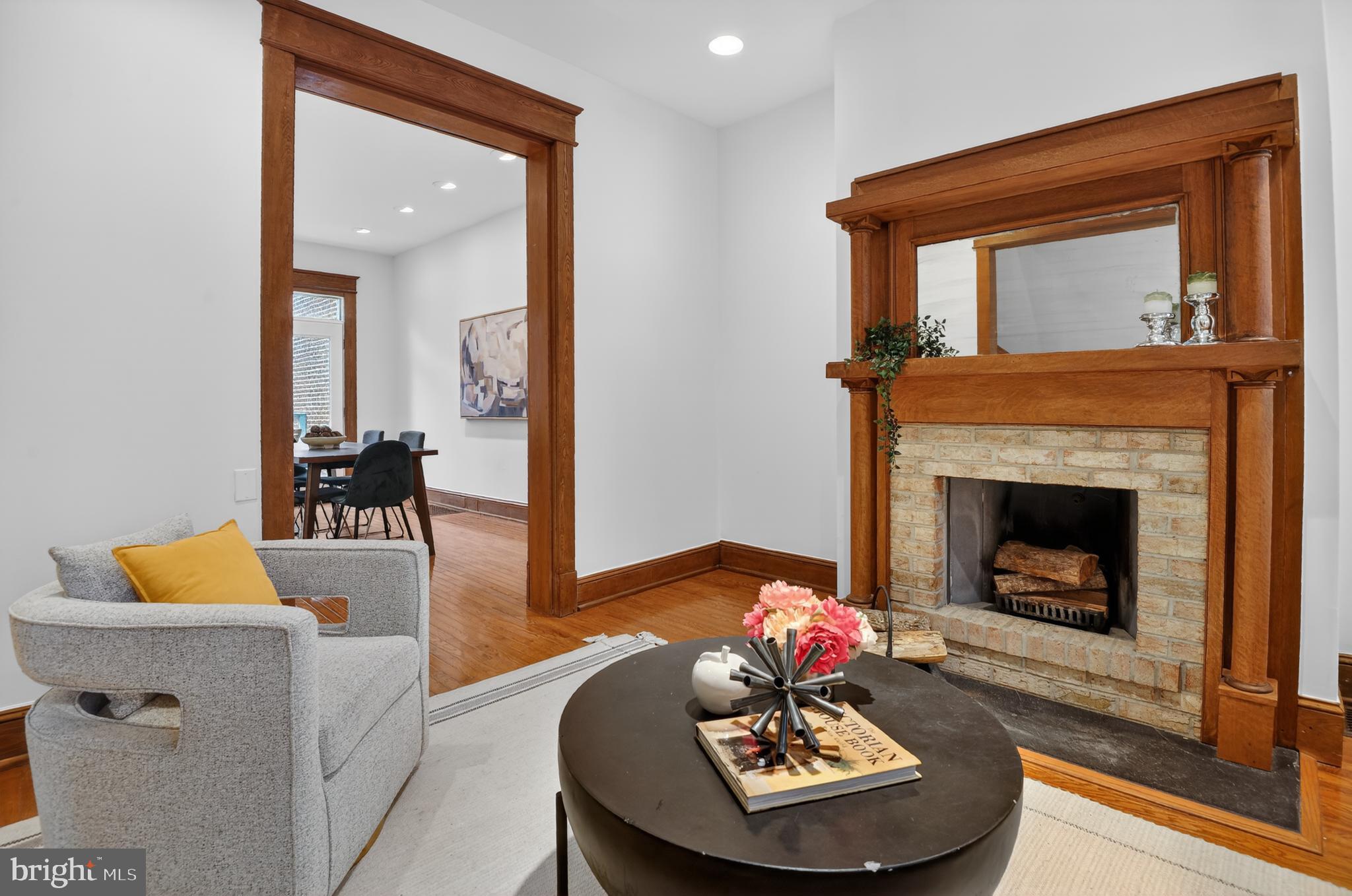 1752 Willard Street Northwest Washington, DC 20009 - Photo 8 of 26 a living room with furniture and a fireplace