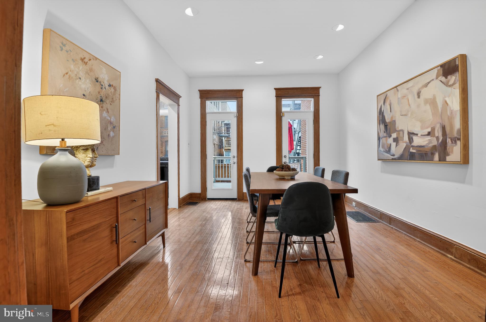 1752 Willard Street Northwest Washington, DC 20009 - Photo 9 of 26 a dining room with wooden floor and furniture