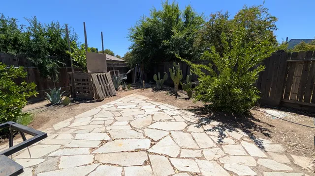 a backyard of a house with lots of green space