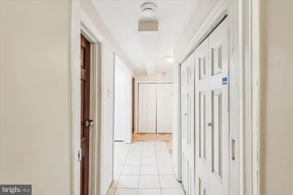 a view of a bedroom with wooden floor