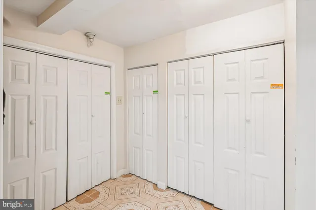 a bathroom with a sink mirror and a toilet