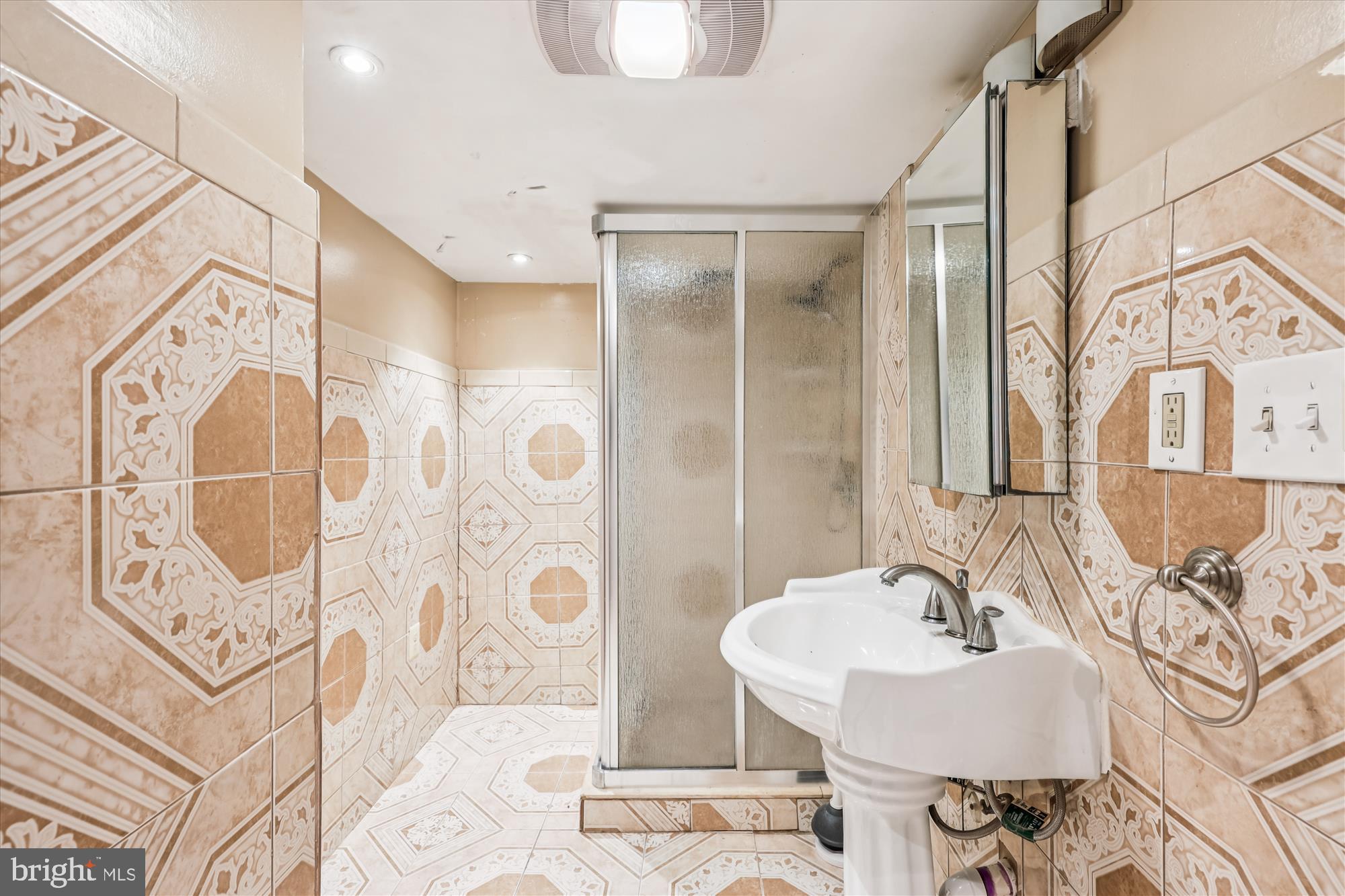 758 19th Street Northeast Washington, DC 20002 - Photo 15 of 23 a bathroom with a bathtub sink and mirror