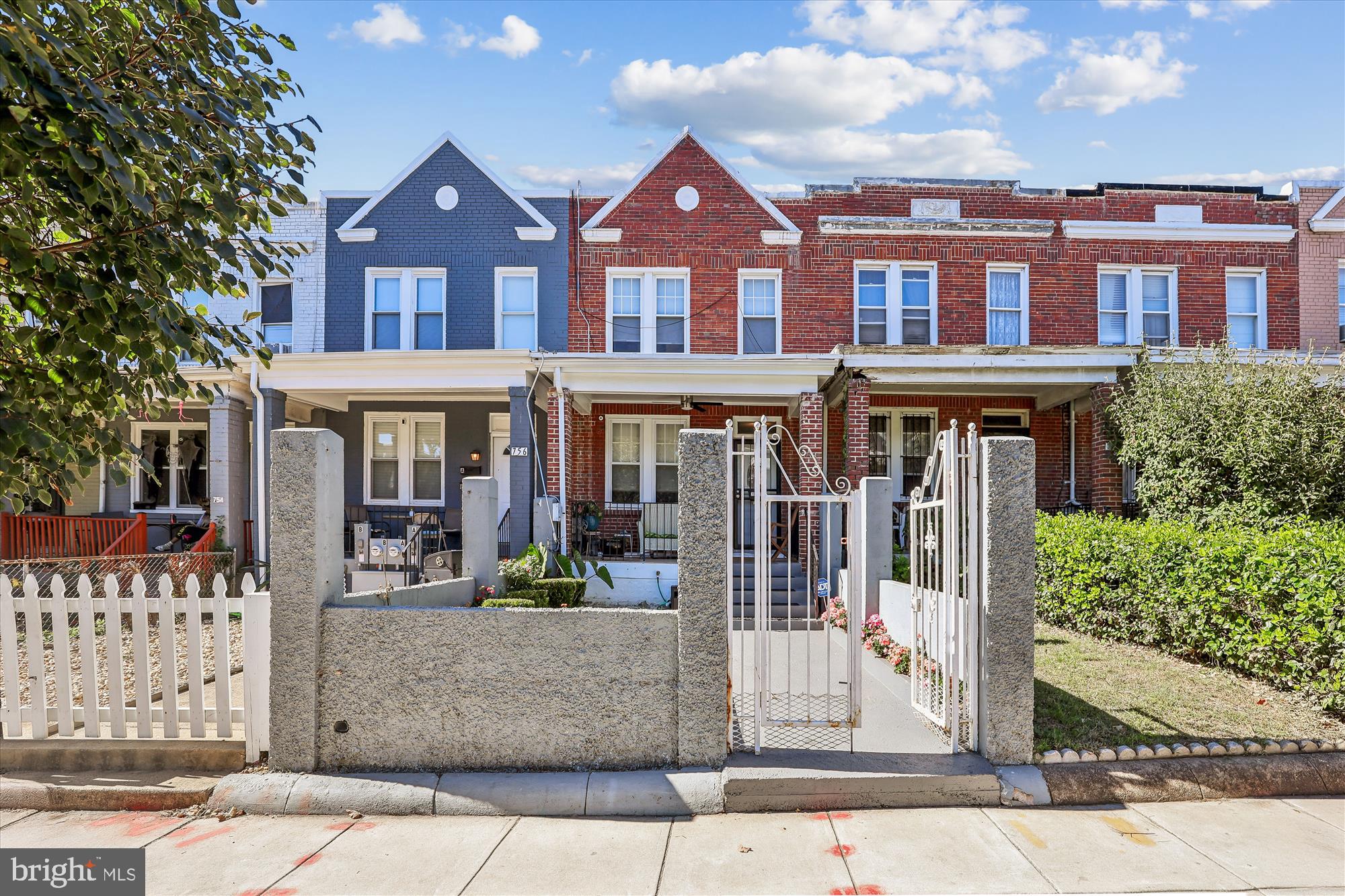 758 19th Street Northeast Washington, DC 20002 - Photo 2 of 23 front view of a brick house with a yard