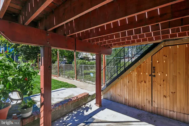 a view of balcony with wooden floor