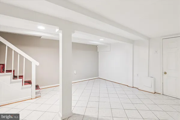 a view of kitchen with refrigerator and stove