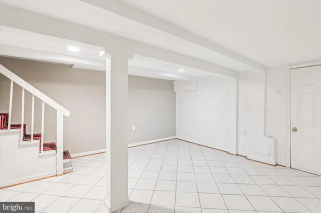 a view of kitchen with refrigerator and stove
