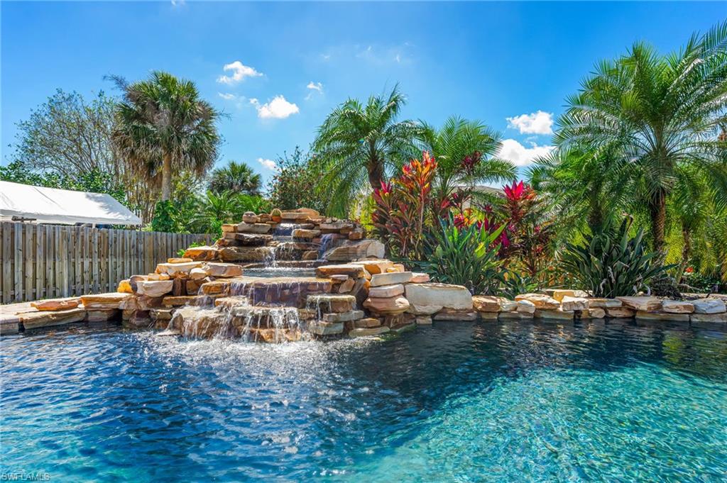 2360 Outrigger Lane Naples, FL 34104 - Photo 39 of 50 a view of a yard with a bench