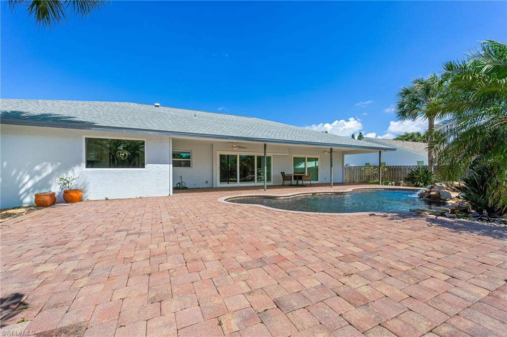 2360 Outrigger Lane Naples, FL 34104 - Photo 45 of 50 a view of house with outdoor space and sitting space