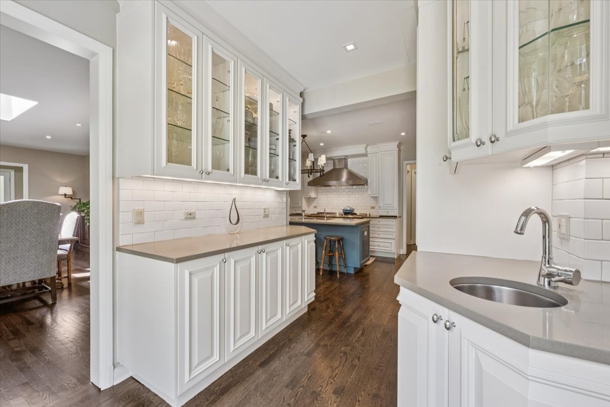 2311 Burr Oak Road Northfield, IL 60093 - Photo 18 of 69 a kitchen with sink stove and cabinets