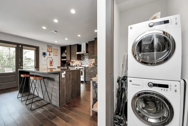 a view of a kitchen with washing machine and a sink