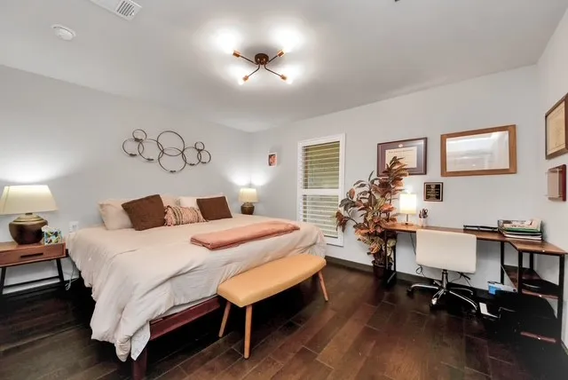 a bedroom with a bed and a table