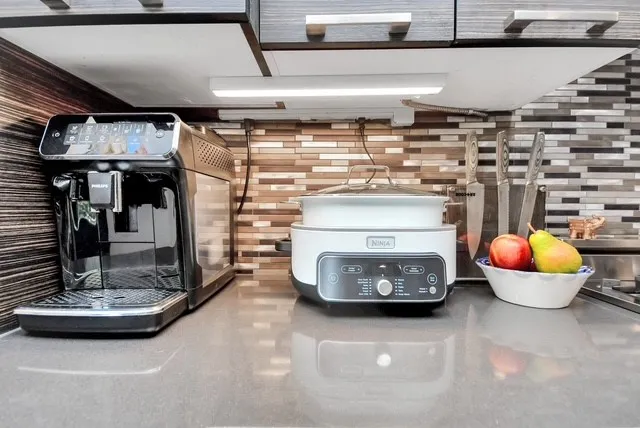 a kitchen with a stove and cabinets