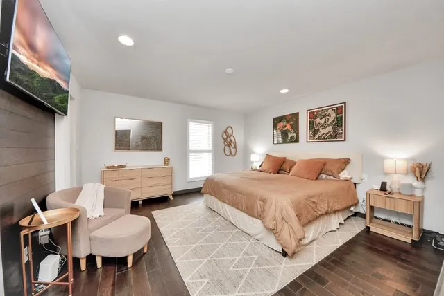 a bedroom with a bed and a couch