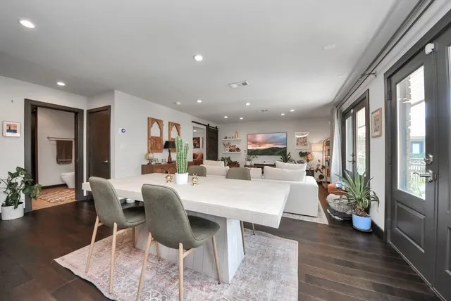 a view of a dining room with furniture window and wooden floor