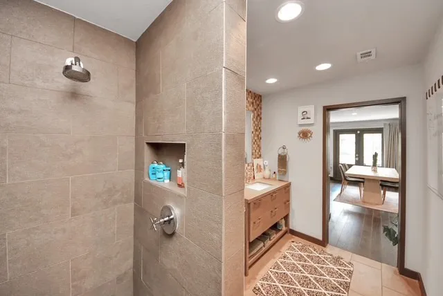 a hallway with a dining table and chairs