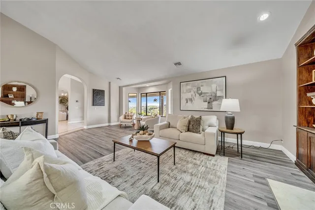 a bathroom with a granite countertop sink a toilet and a shower