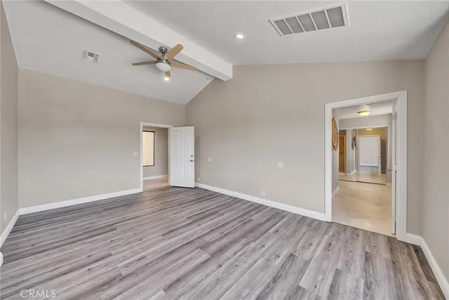 a living room with furniture and large windows