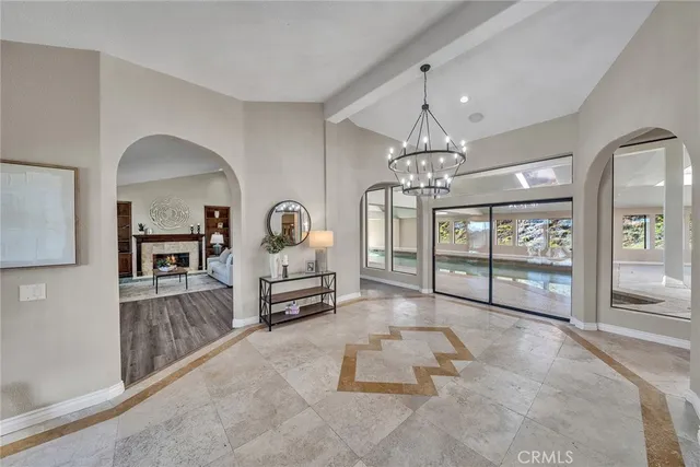 a large kitchen with kitchen island granite countertop a large counter and utility room