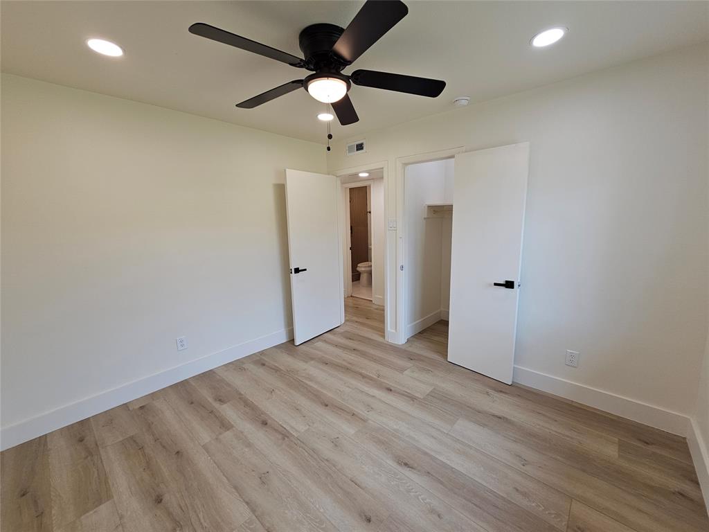 1725 R Avenue, Unit 1727 Plano, TX 75074 - Photo 16 of 20 Bedroom featuring wood-finish flooring, recessed lighting, a ceiling fan with light, and white trim
