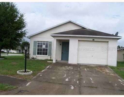 113 Diamond Ridge Boulevard Auburndale, FL 33823 - Photo 1 of 1 a front view of a house with a yard and garage